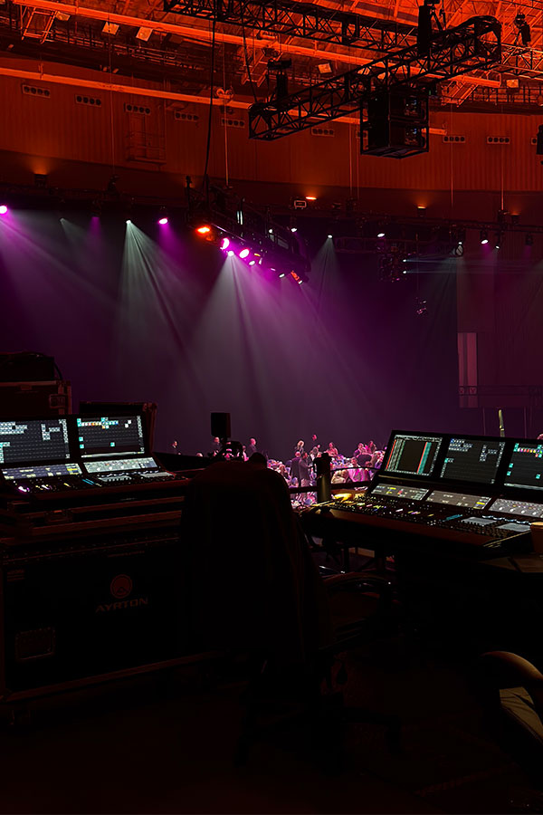 Image from Visit Fort Worth of technician controlling gear on stage