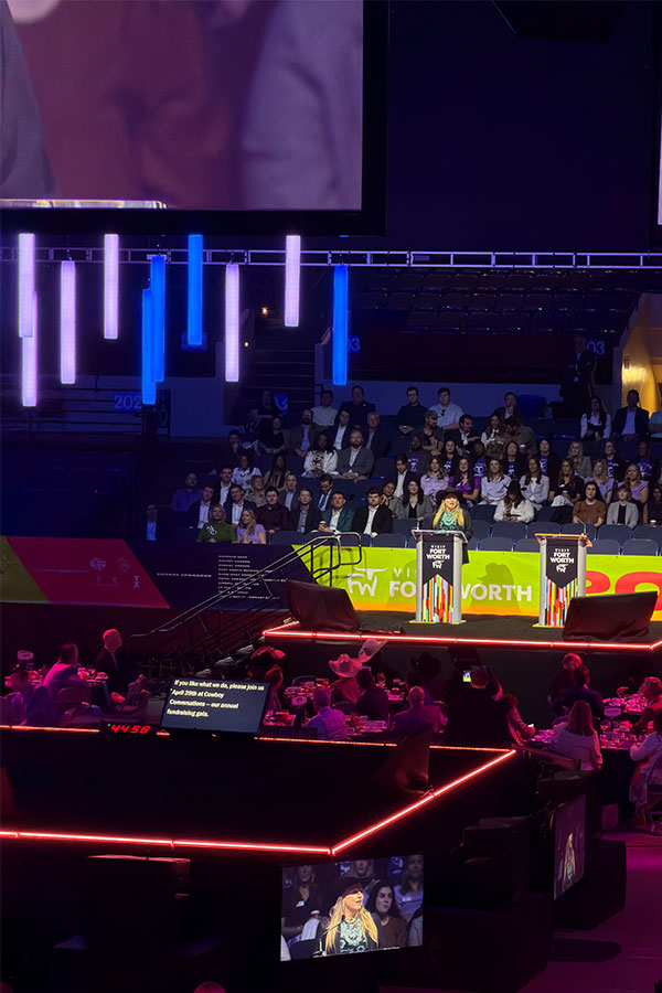 Image from Visit Fort Worth of speaker on stage at the side