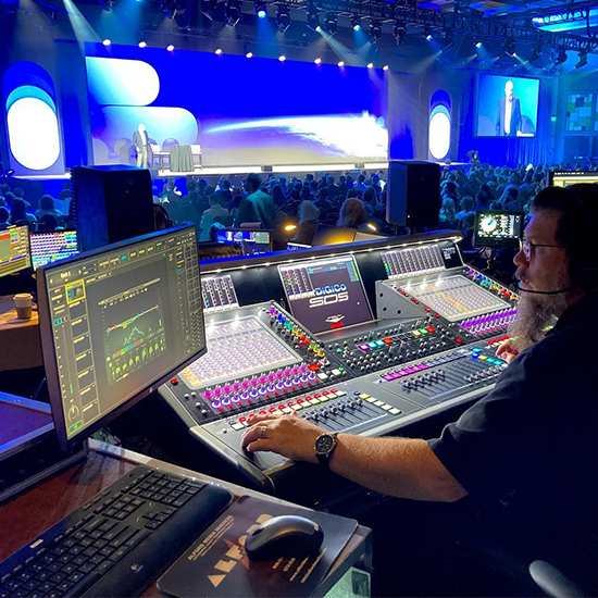 Audio technician monitoring live feeds