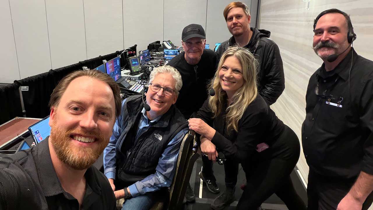 employees working together behind the scenes at an event 